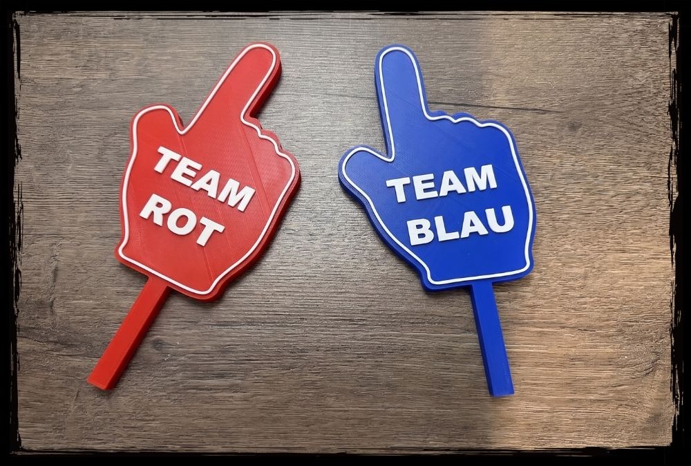 Rote und blaue Hand-Schilder mit Aufschrift Team Rot und Team Blau als Fotobox Props